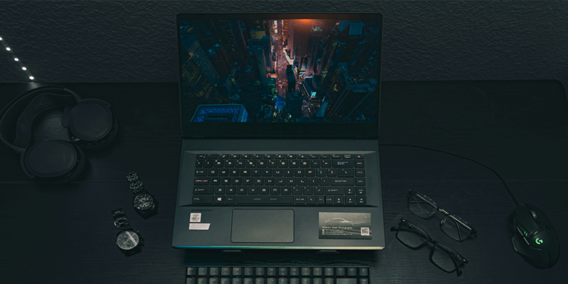 Gaming laptop on black desk.